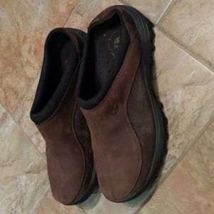 Men's Timberland brown leather slip-on shoes.